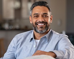 Man in blue shirt smiling