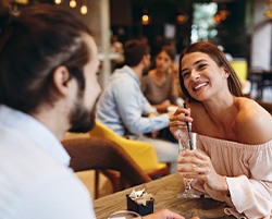 Woman smiling during date at restaurant