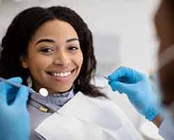 Woman smiling during dental checkup